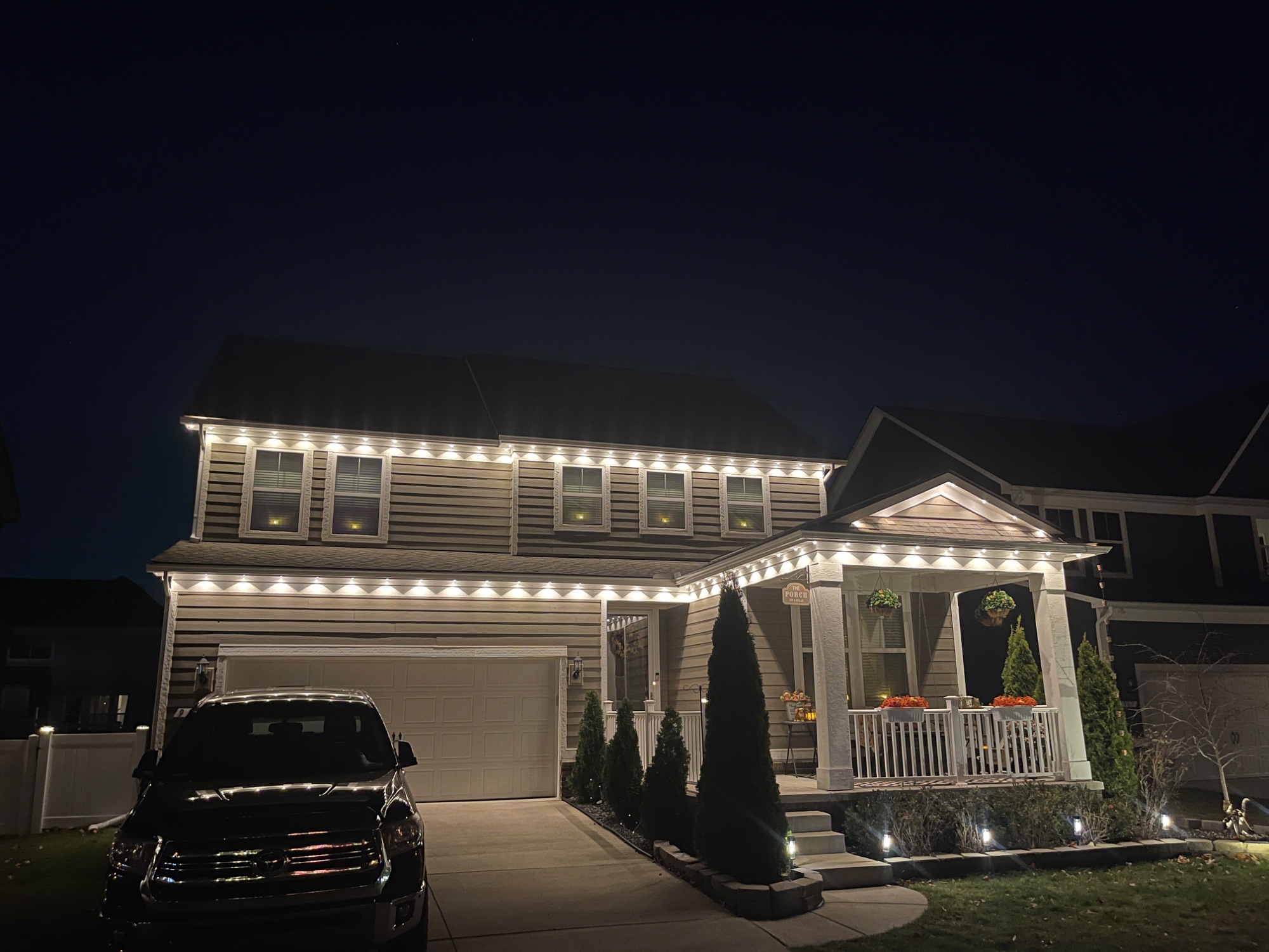 Low-voltage landscape lighting installation at dusk, Southeast Michigan